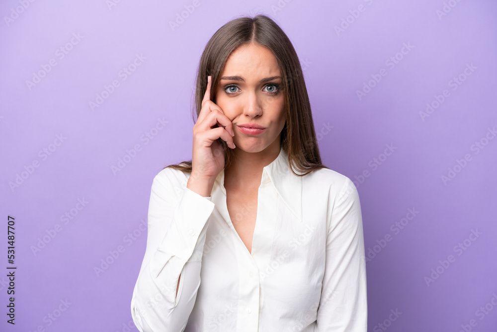 Young caucasian woman isolated on purple background thinking an idea Young caucasian woman isolated on purple background thinking an idea