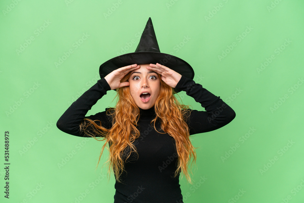 Young caucasian woman costume as witch isolated on green screen chroma key background with surprise expression Young caucasian woman costume as witch isolated on green screen chroma key background with surprise expression