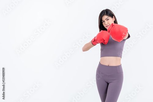 Portrait images of Asian attractive woman Wearing red boxing gloves, is good shape, on white background, concept to people sport recreation and health care concept.