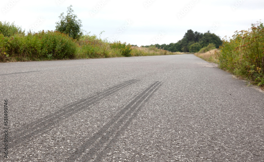 Auto tire rubber on the asphalt
