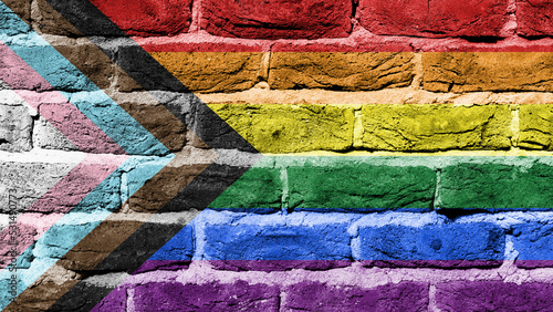 Progress LGBTQ rainbow on a brick wall