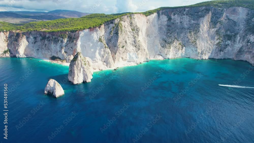 Aerial view of Zakynthos Greece Limni Keri rock island. Sunrise. Mizithres limestone formation in sea. Myzithres, Europe, Ionian sea. Turquoise clear blue water with white sands and green cliffs
