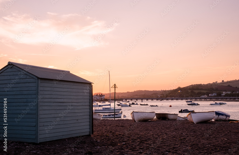 A rowing boat moored on Teignmouth's 'Back Beach' at sunset. A rowing boat moored on Teignmouth's 'Back Beach' at sunset.