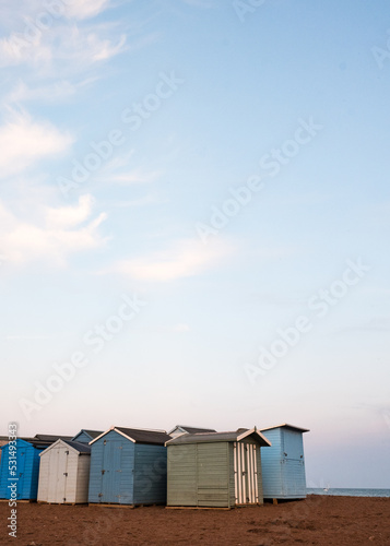 Beach Huts On Teignmouth's Back Beach At Sunset
