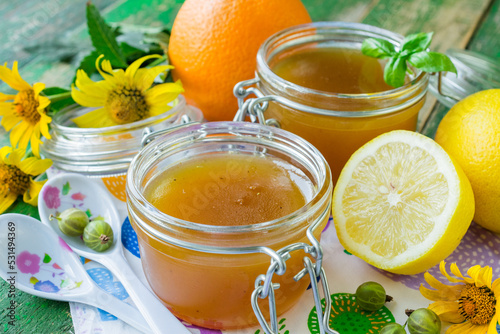 Gooseberry jam with orange and lemon. Gooseberry marmalade. Homemade gooseberry jam with lemon and orange photo