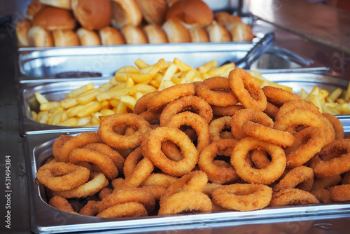 Onion rings and french fries, fast street food.