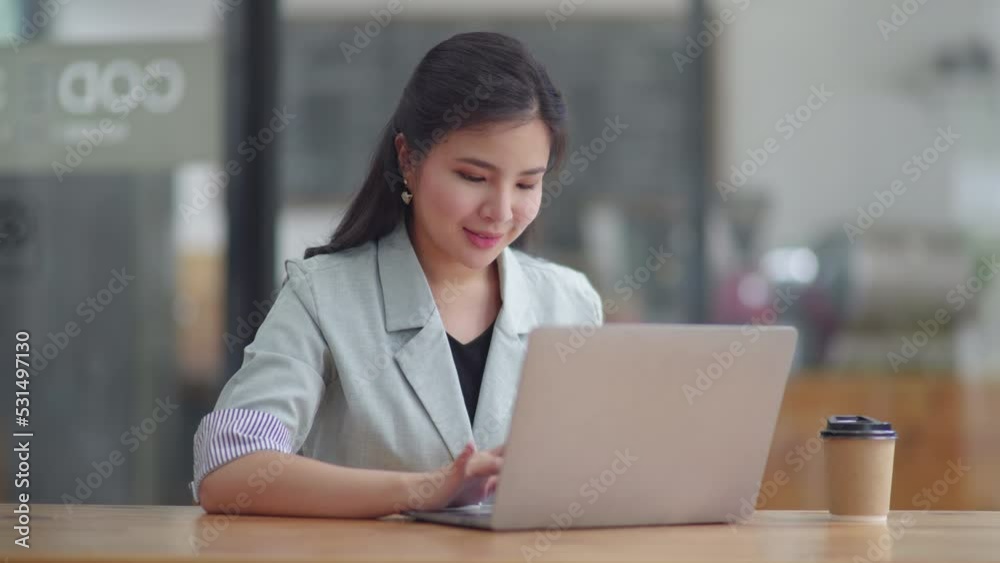 Young business women working and typing on laptop with happy and smile face on office space. Young business women working and typing on laptop with happy and smile face on office space.
