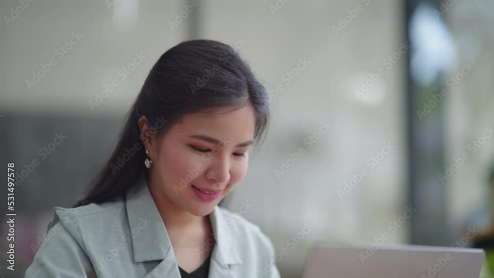 Young business women working and typing on laptop with happy and smile face on office space. Young business women working and typing on laptop with happy and smile face on office space.