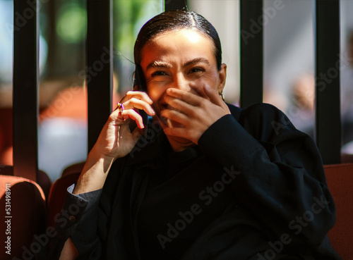 woman on the phone smiling 