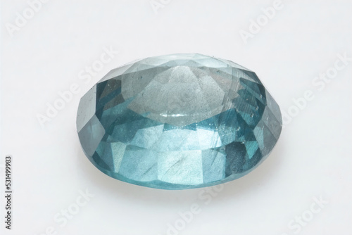 Natural gemstone blue zircon on background