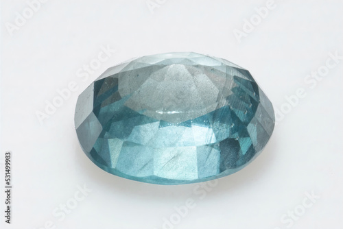 Natural gemstone blue zircon on background photo