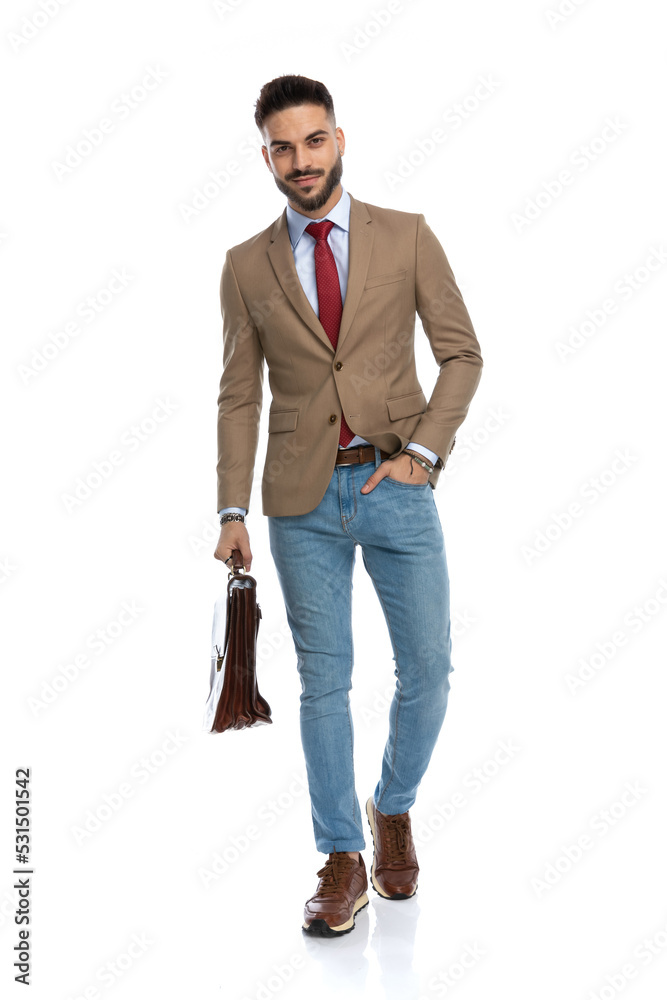 sexy bearded businessman with bag holding hand in pocket sexy bearded businessman with bag holding hand in pocket
