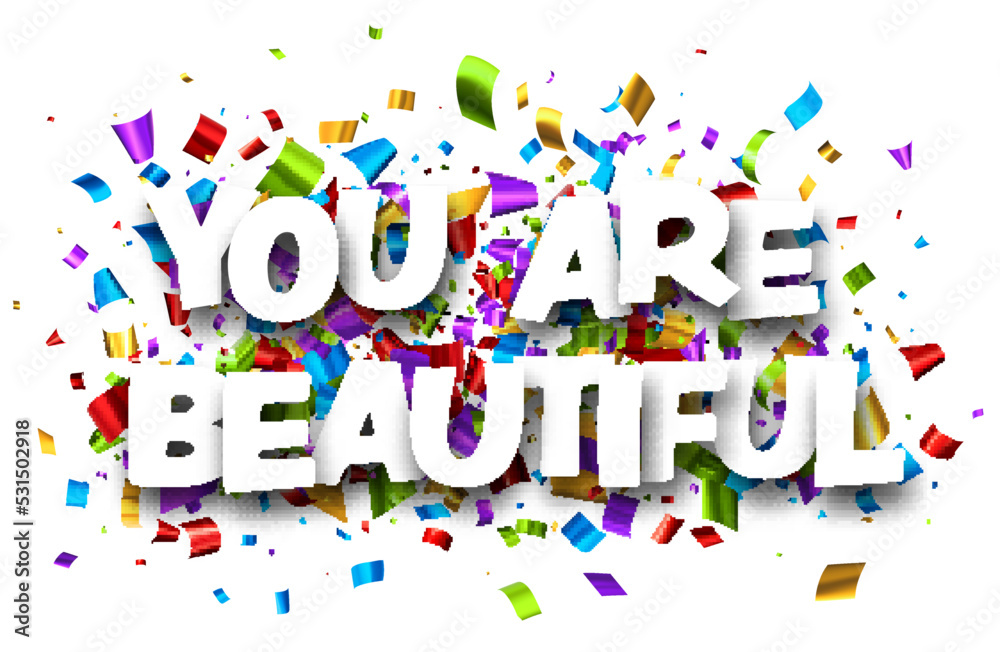 You are beautiful sign on cut ribbon confetti background. You are beautiful sign on cut ribbon confetti background.