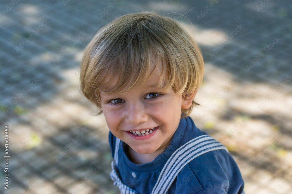 Portrait of the smiling face of an adorable little boy. Blond toddler smile Portrait of the smiling face of an adorable little boy. Blond toddler smile