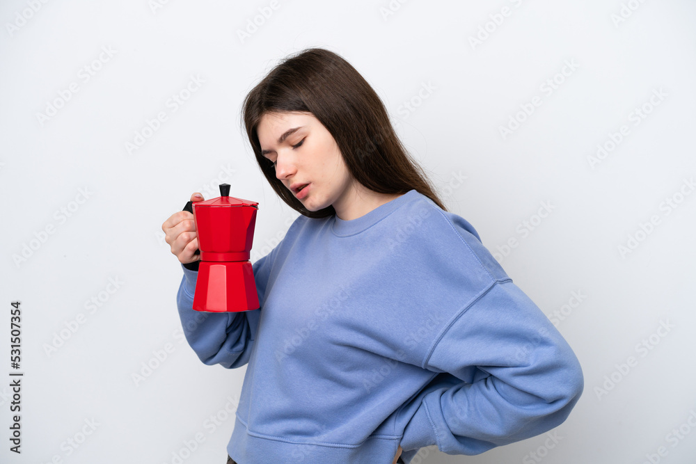 Young Russian woman holding coffee pot isolated on white background suffering from backache for having made an effort Young Russian woman holding coffee pot isolated on white background suffering from backache for having made an effort