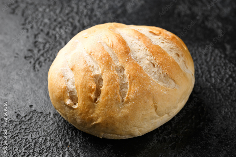 Fototapeta premium Fresh Homemade cob bread on rustic dark background
