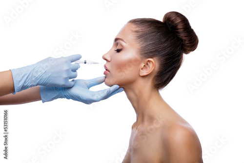 Beautiful woman gets injections. Cosmetology. Beauty Face, doctor's hands in the frame photo