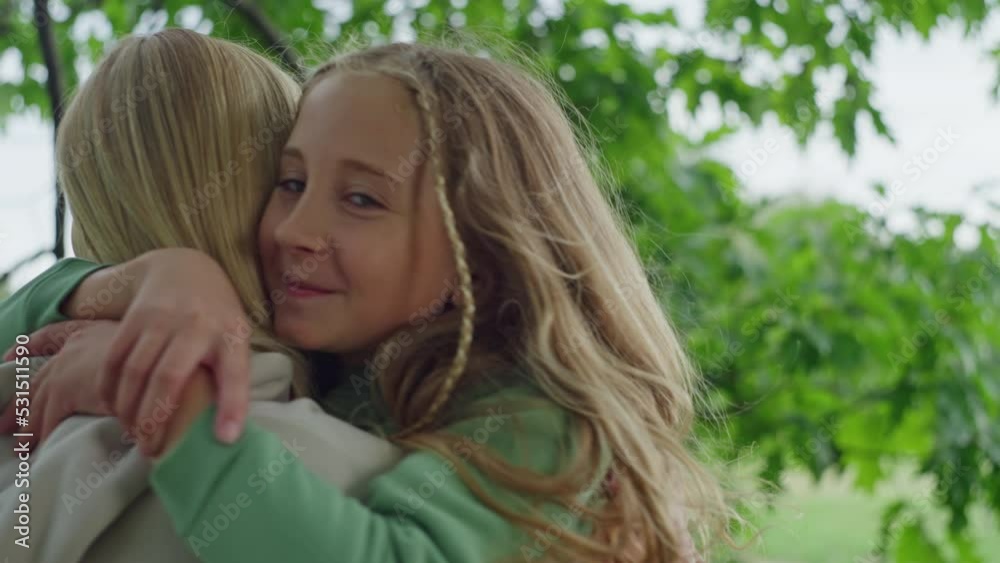 Mother spins her daughter in her arms. Lifestyle hugs of a happy family. Smiles of European blondes in the park. High quality 4k footage Mother spins her daughter in her arms. Lifestyle hugs of a happy family. Smiles of European blondes in the park. High quality 4k footage