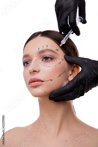 People, Lips, cosmetology, plastic surgery and beauty concept - beautiful young woman face and hand with syringe making injection