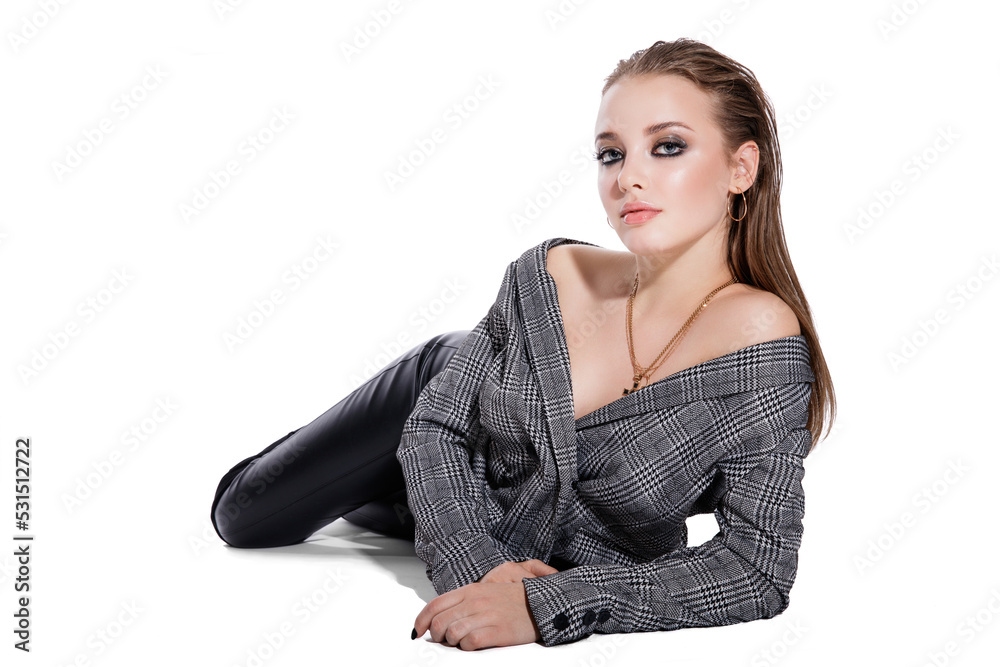 High fashion photo of a beautiful elegant young woman in a pretty gray jacket blazer, leather pants, boots on white background. Studio Shot. High fashion photo of a beautiful elegant young woman in a pretty gray jacket blazer, leather pants, boots on white background. Studio Shot.