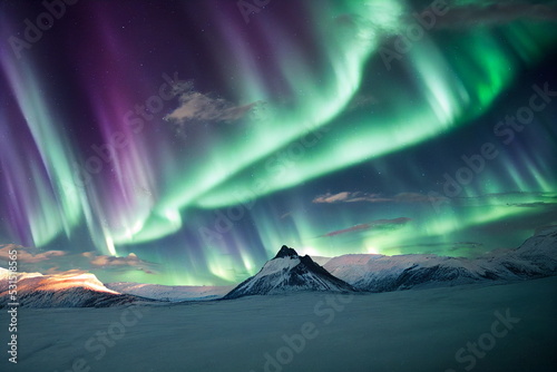 Northern Lights over snowy mountains. Aurora borealis with starry in the night sky. Fantastic Winter Epic Magical Landscape of Mountains. Gaming RPG background and texture. Game asset © Abstract51