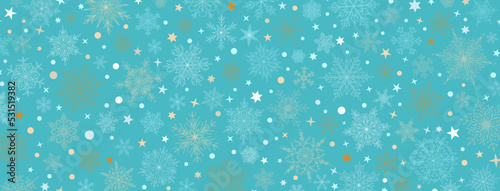 Background of complex big and small Christmas snowflakes in light blue colors. Winter illustration with falling snow