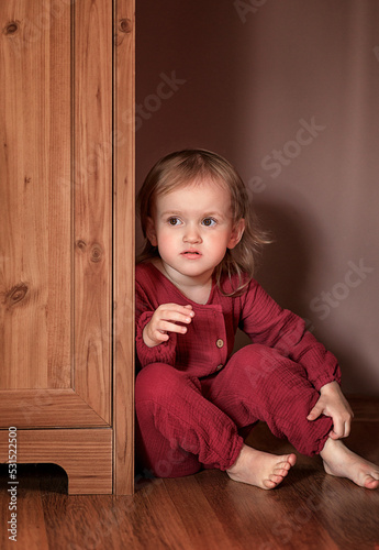 Little girl behind the closet