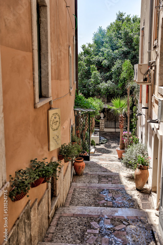Taormina, Italy - July 22, 2022: Scenic streets and sidewalks in Taormina, Sicily 