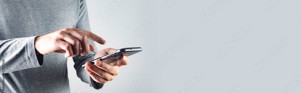 Young man holding a phone Young man holding a phone