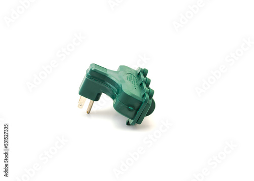 Green outdoor grounded wall tap adapter 3 outlet extender with covers isolated on white background
