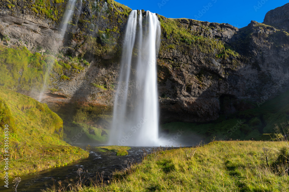 seljalandsfoss waterfall in the mountains of iceland