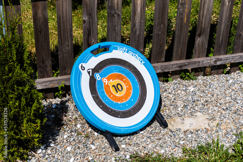 Round archery target in a garden.