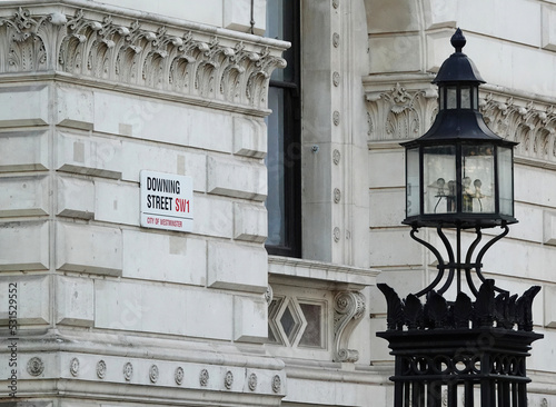 Downing Street sign on a wall in Westminster, London, UK.  photo