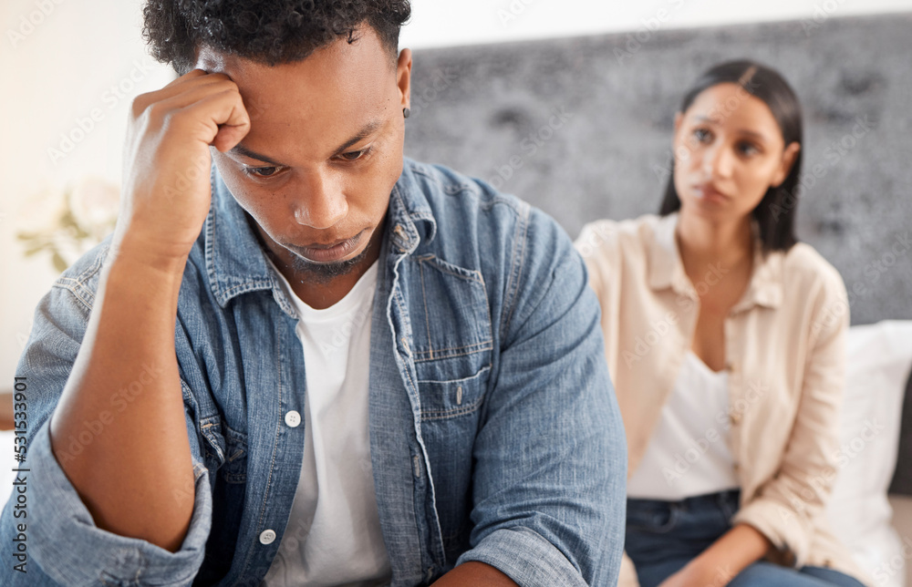Obraz premium Problem, fight and depressed couple argue in bedroom at home together for cheating, divorce or mental health. Angry, sad or fail with frustrated man ignoring woman in toxic relationship