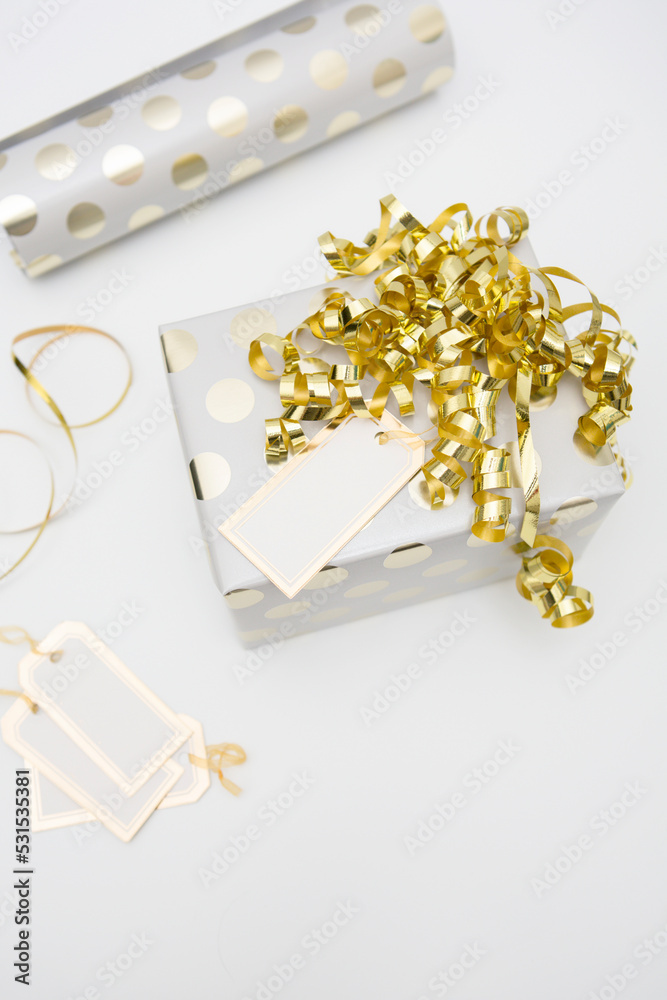 Gold and white wrapped Christmas gift Gold and white wrapped Christmas gift