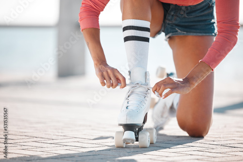 Skate, shoes and woman sport fitness athlete on a beach boardwalk about to start skating. Sports, workout and training of a healthy female on a summer day working on a skater exercise for cardio