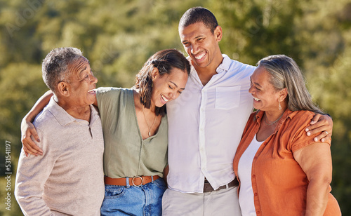 Vászonkép Happy, hug and smile, an adult family in a park standing together
