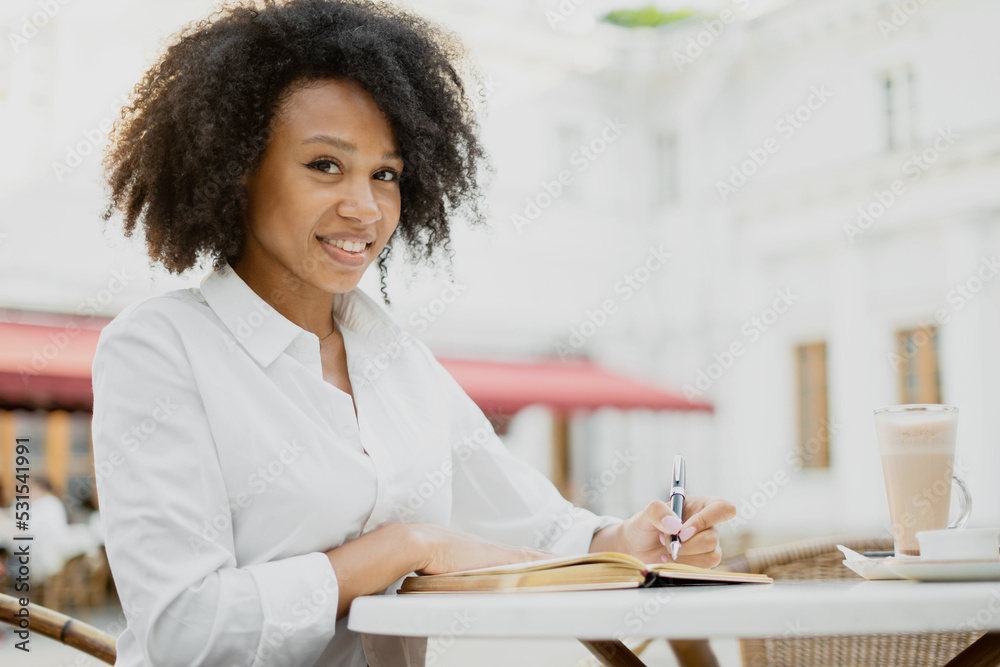 A young woman uses a notebook A young woman uses a notebook