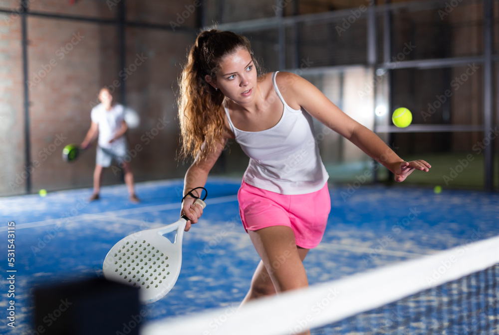 Fototapeta premium Padel tennis woman in court ready for play and train