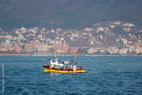 Small fishing boat with fishing net and equipment
