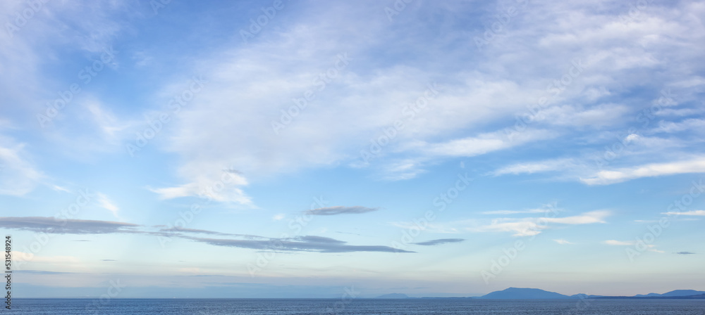 Cloudy Cloudscape during sunny summer Day on the West Coast of Pacific Ocea