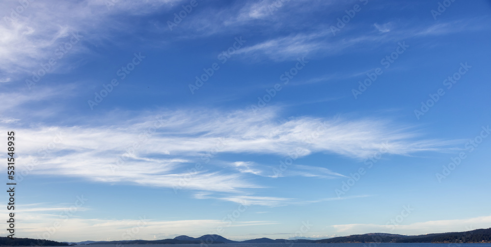 Cloudy Cloudscape during sunny summer Day on the West Coast of Pacific Ocean.