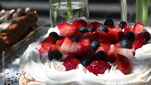 meringue pavlova chantilly cream strawberries and blueberries