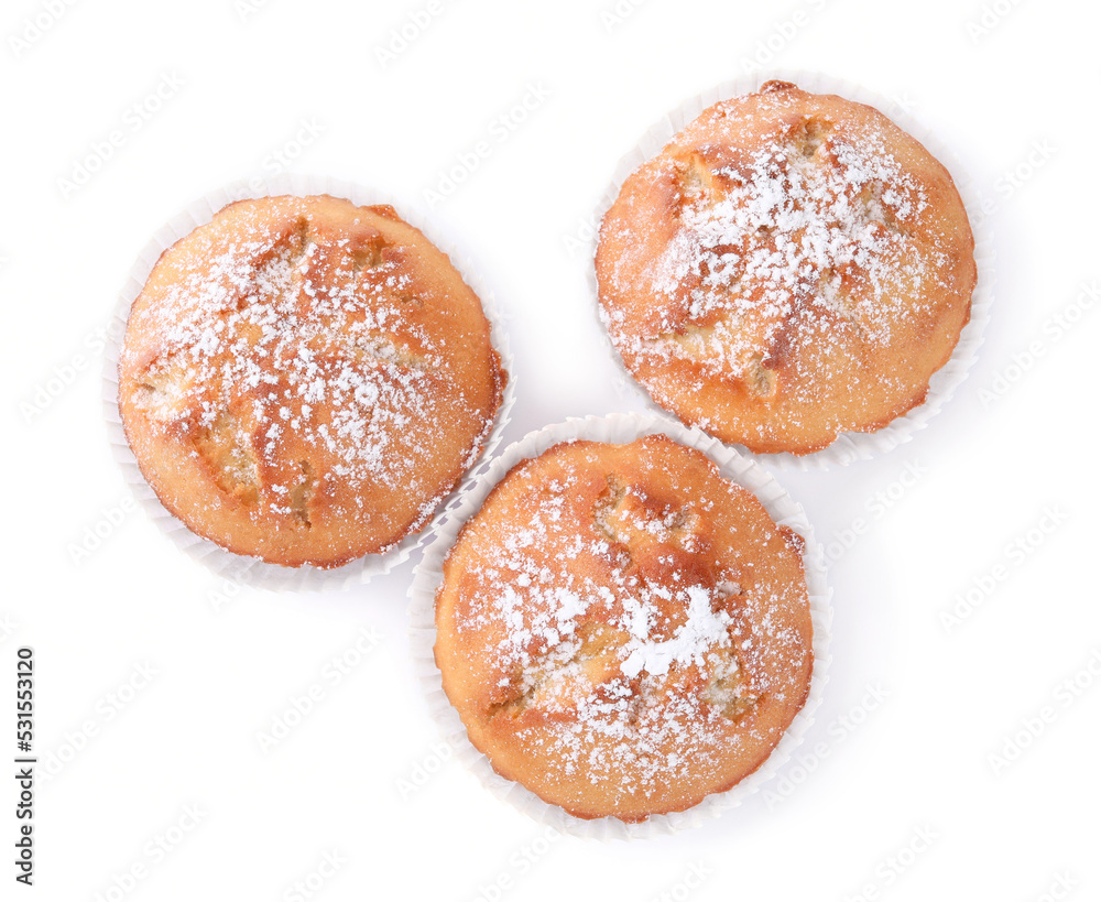 Tasty muffins powdered with sugar on white background, top view
