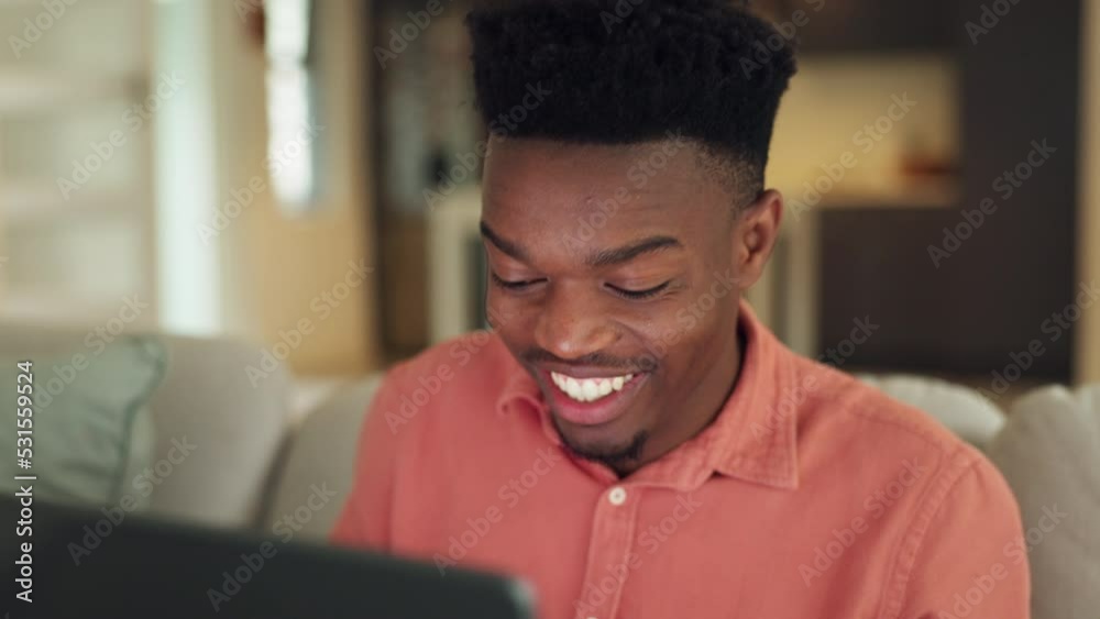 Happy, excited and a black man with laptop on sofa, celebration email news. Happy student gets loan or approval from university application. Success online, celebrate and a winner in the living room.
