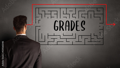 businessman drawing maze concept