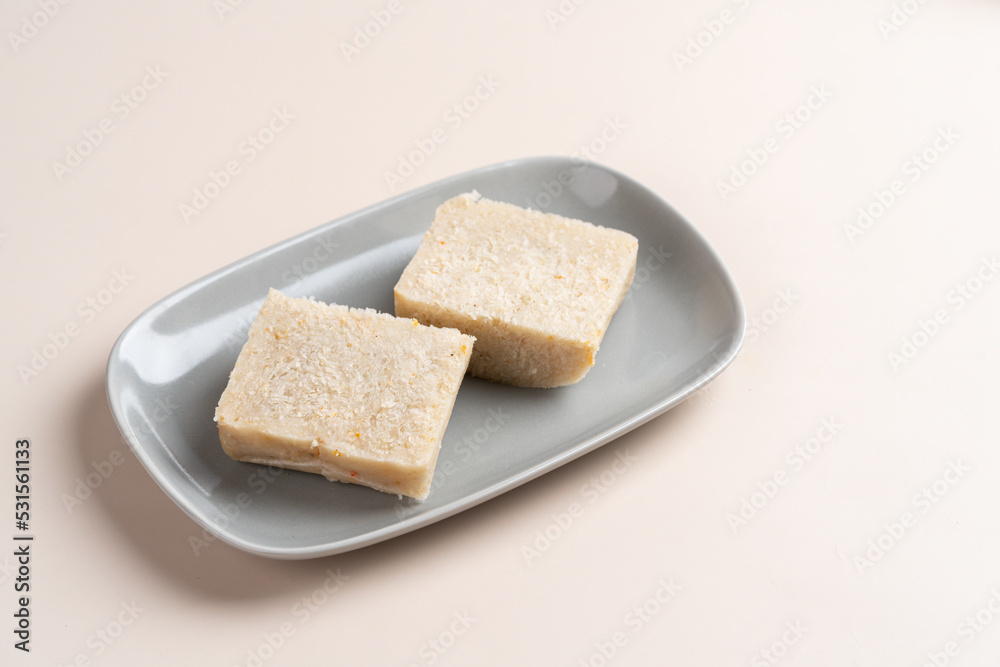 Raw Turnip cake (Chinese : Chai tow kway ). Turnip cake  is a common dish or dim sum of Teochew cuisine in Chaoshan, China usually cut into rectangular slices and sometimes pan-fried before serving.