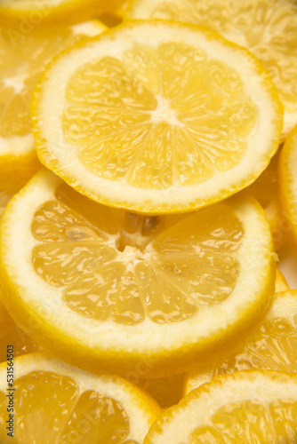 close up of yellow lemon slices, fresh cut lemon slices used to create savory dishes, lemonade, lemon desserts, lemon water