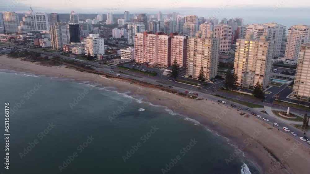 Coastal road close to beach at sunset, Punta del Este city in Uruguay. Aerial drone panoramic view Coastal road close to beach at sunset, Punta del Este city in Uruguay. Aerial drone panoramic view