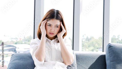 Stress asian women headache have migraine feeling temples stressfull upset depressed. Strong headache migraine exhausted young girl. Office syndrome unhealthy Tension person. Woman headache concept